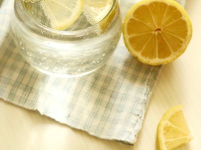Glass of water with lemon on a table